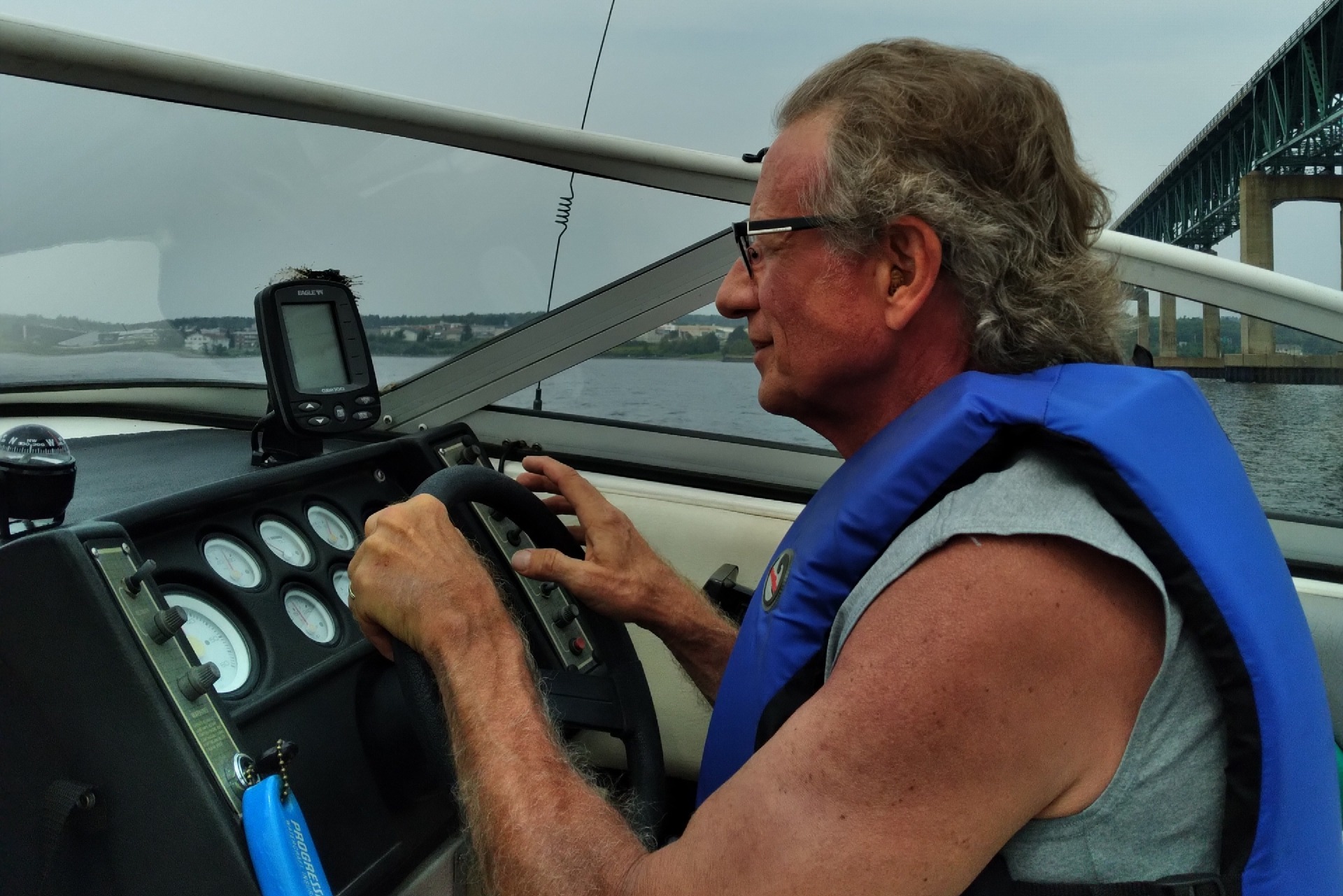 Retirement: picture of the author at the helm of his (former) boat