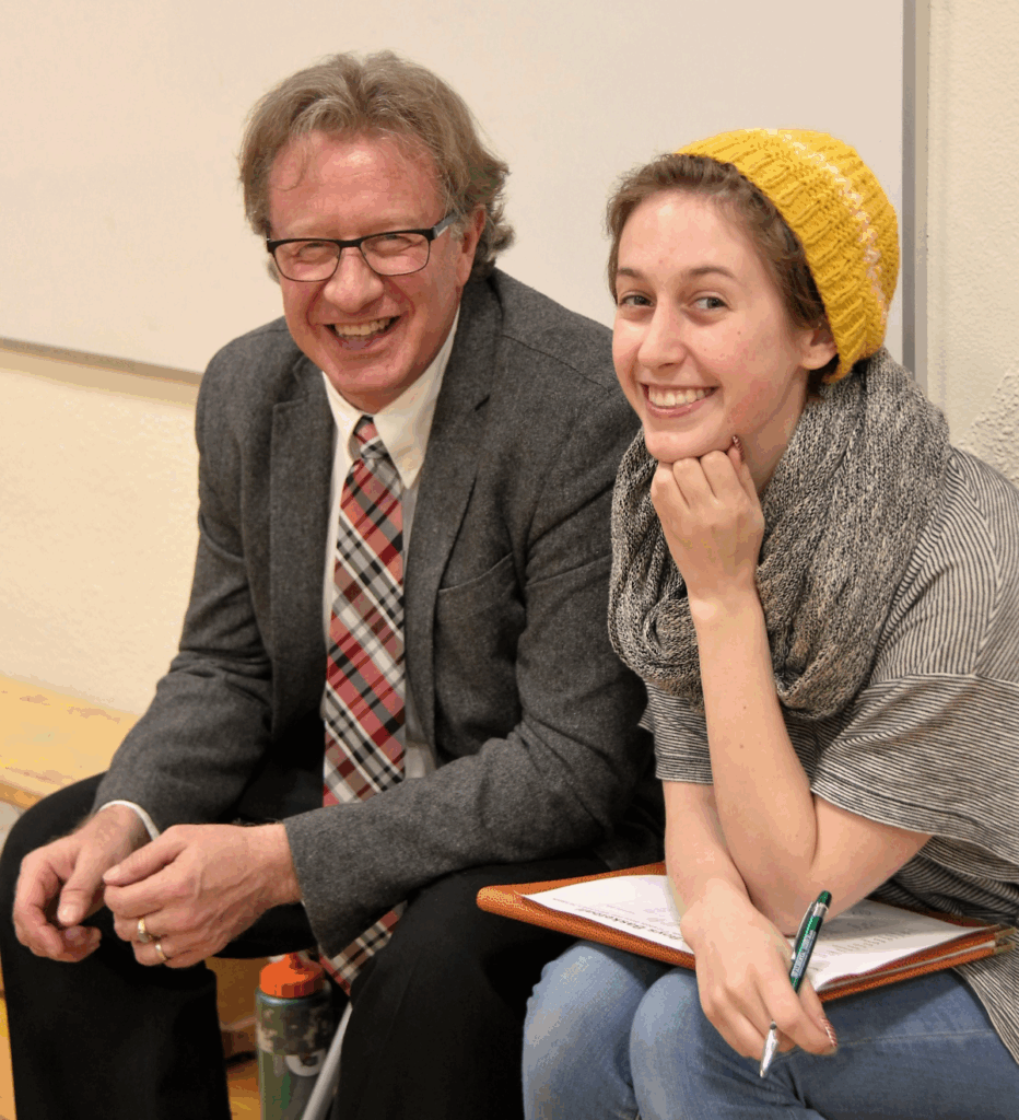 Author and his daughter sitting on the bench while coaching a basketball game in 2016