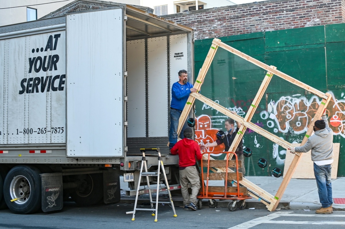 moving truck being loaded with an undetermined item