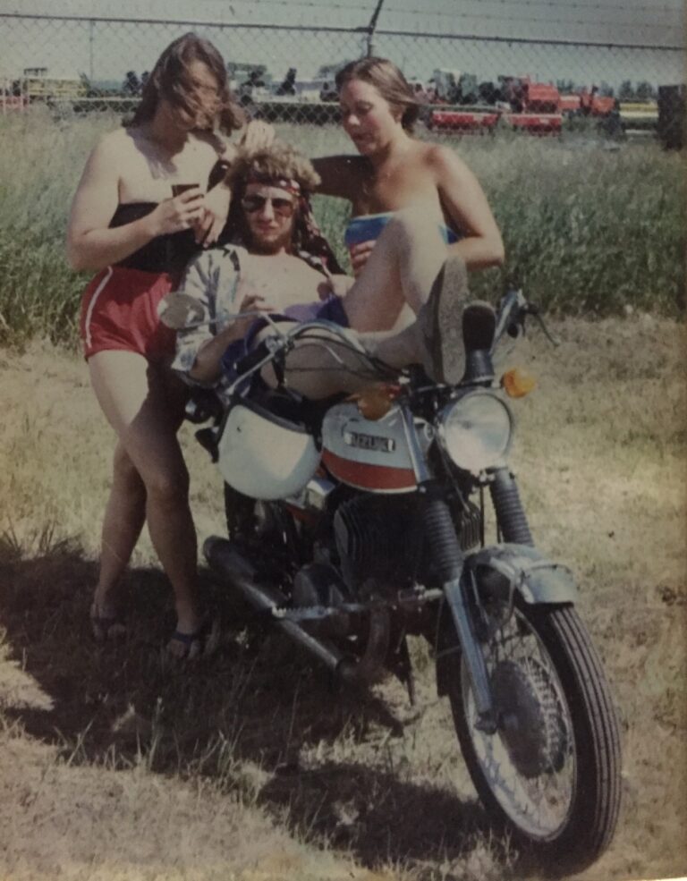 Author in 1980 kicked back on his 1972 Suzuki 500 with two girls at his side