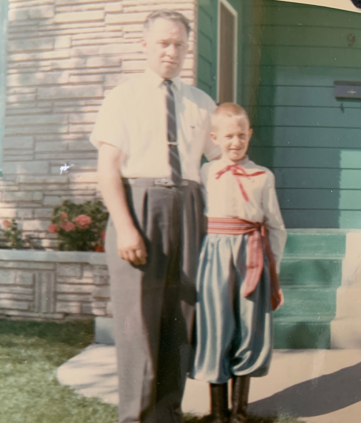 Man and boy, with boy wearing Ukrainian dance costume