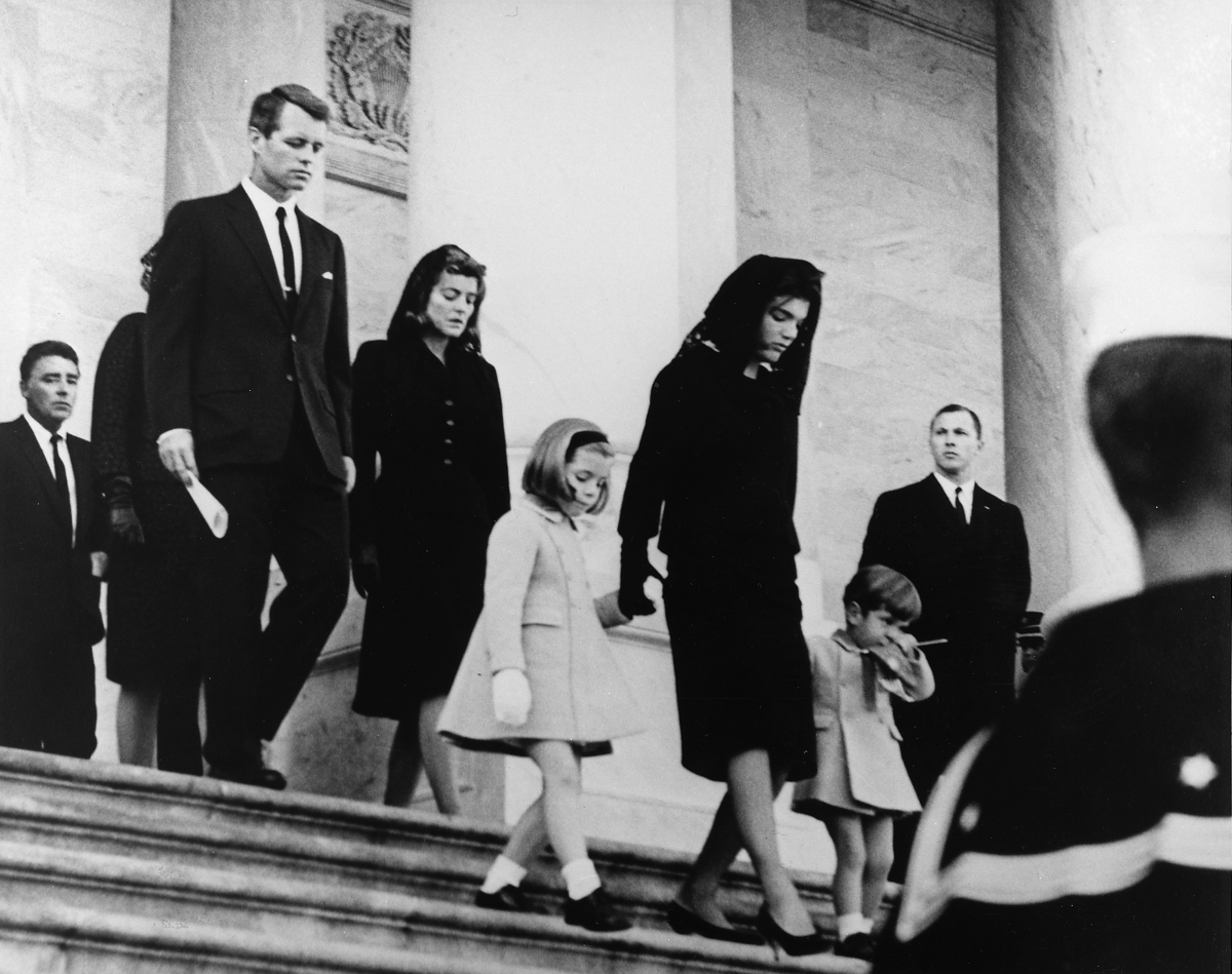 The first time - John F Kennedy's family leaving the church after his funeral